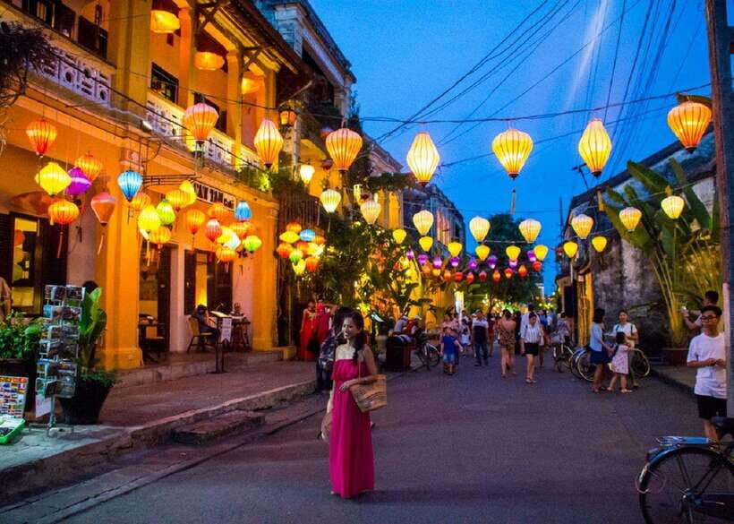 From Da Nang: Hoi An City Tour W Boat Ride - Lantern Release - Japanese Bridge: meaning behind the carved paintings